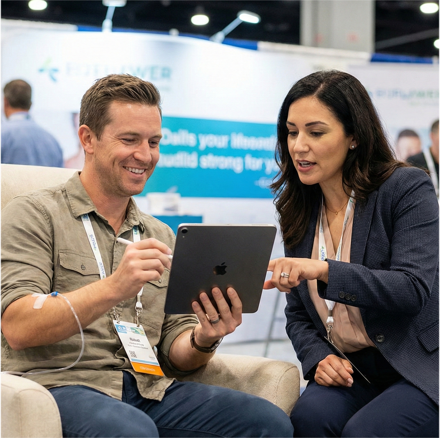 Organizer engaging with attendee during IV therapy session